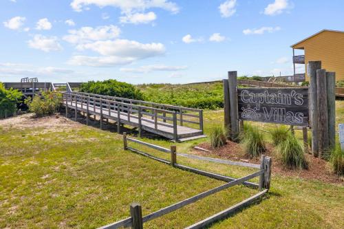 a sign that says congratulations on the wiles at a park at Captain's Villa 6-B in Holden Beach