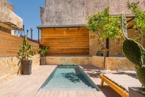 a pool in the backyard of a house at Sofia Villa in Krousón