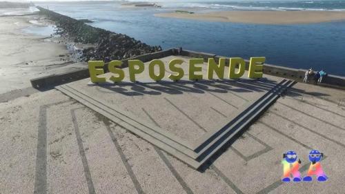two lego figurines in front of a sign on a beach at Esposende 3 Bedrooms Balcony Center Flat in Esposende