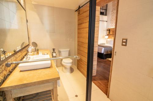 a bathroom with a sink and a toilet at Sonesta Posadas del Inca - Valle Sagrado Yucay Urubamba in Urubamba