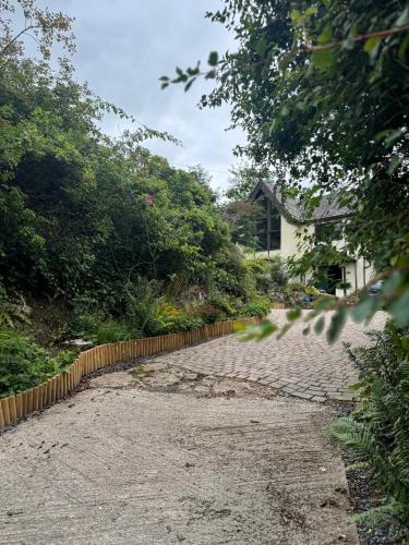 a brick road in front of a house at Hafan Deg in Llanferres