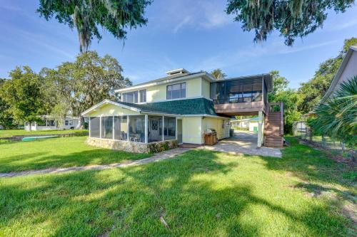an exterior view of a house with a large yard at Dora Canal Views and Shared Dock Apt in Tavares! in Tavares