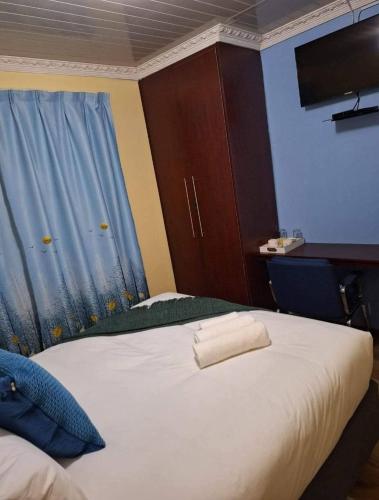 Кровать или кровати в номере Salisha Bed & Breakfast