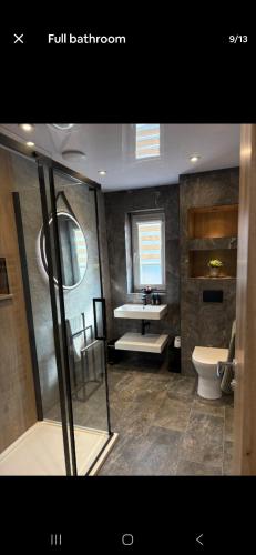 a bathroom with a sink and a toilet at The Wee Bothy in Oban