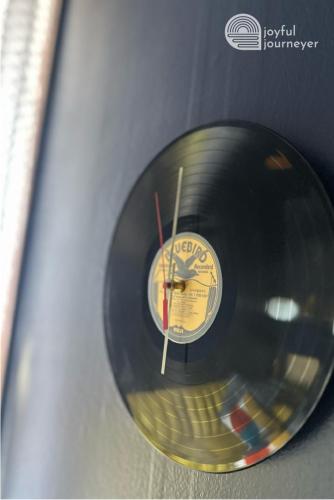 a cd with a clock on top of it at Friendly Suite Home Chicago in Berwyn