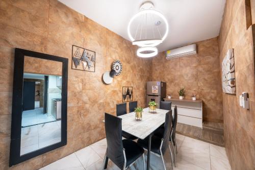 a dining room with a table and chairs at 5 Bedroom - 1 Block from Lleras - P2 in Medellín