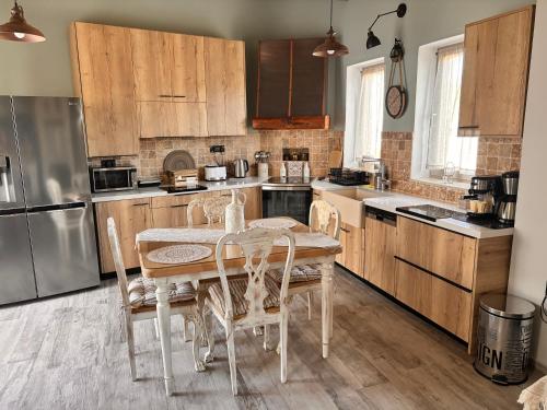 a kitchen with a table and chairs in it at Villa Katrinia in Sitia