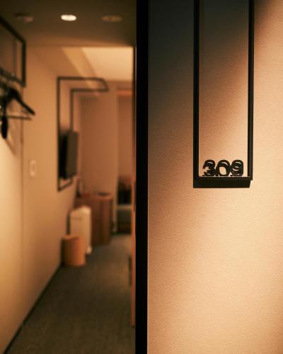 an open door to a hallway in an office at hotel androoms Shin-Osaka in Osaka
