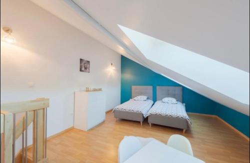 Katil atau katil-katil dalam bilik di Maison de ville très moderne proche Amnéville, Batilly, Briey, Metz