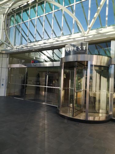 an entrance to a building with a glass ceiling at Harbour Steps in Tauranga