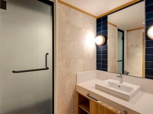 Koupelna v ubytování KAMENOI HOTEL Ako