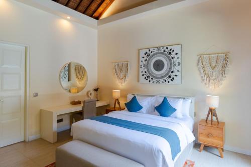 Ένα ή περισσότερα κρεβάτια σε δωμάτιο στο Boholuma Villas
