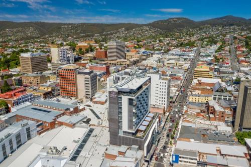 an aerial view of a city with buildings at Crowne Plaza Hobart by IHG in Hobart