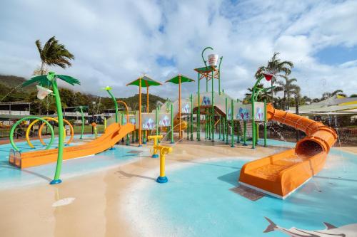 a water park with a playground with slides and slidesktop at Ingenia Holidays Cairns Coconut in Cairns
