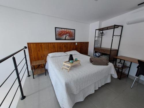 Ένα ή περισσότερα κρεβάτια σε δωμάτιο στο Lofts Indaiatuba