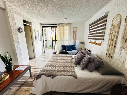 Cama o camas de una habitación en Ecohotel campestre Rionegro-A 20 minutos del aeropuerto