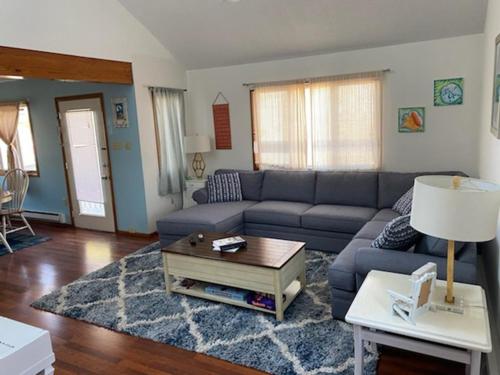 a living room with a couch and a table at Oceanside, Single Family, Private Yard, Wifi, Washer Dryer, Ocean Side Home In Beach Haven 60092, in North Beach Haven