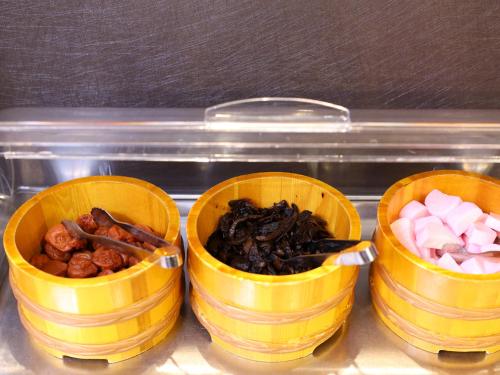 three plastic containers filled with different types of food at Dormy Inn Tokyo Hatchobori - Natural Hot Spring in Tokyo