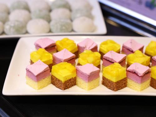 a white plate topped with different types of desserts at Dormy Inn Tokyo Hatchobori - Natural Hot Spring in Tokyo