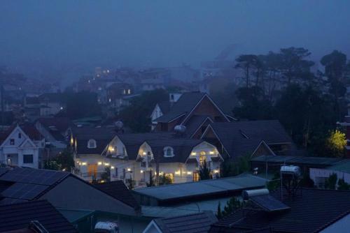 a group of houses in a city at night at TTG Hostel In Da Lat in Da Lat