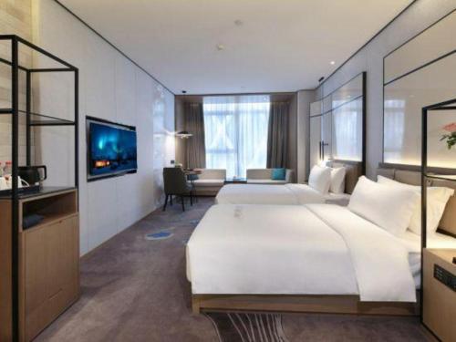 Cama o camas de una habitación en Shenzhen Apex Hotel (Technology Park Branch)