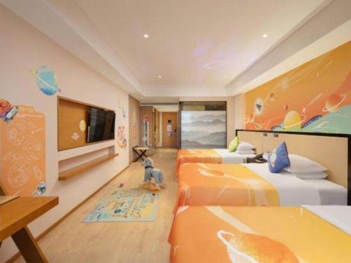Ένα ή περισσότερα κρεβάτια σε δωμάτιο στο The Hotel V Nanjing Confucius Temple