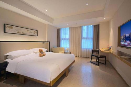 Ένα ή περισσότερα κρεβάτια σε δωμάτιο στο The Hotel V Nanjing Confucius Temple