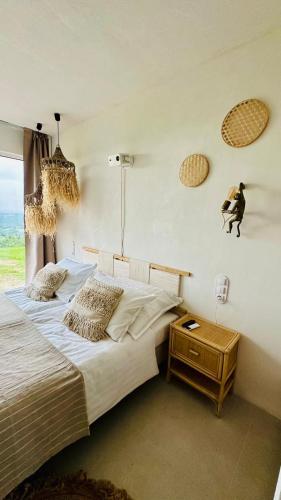 a bedroom with a large bed and a window at Zarnowa464 in Zarnowa