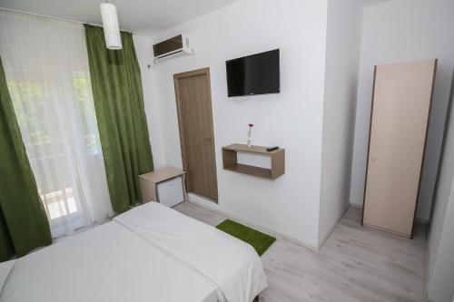 TV a/nebo společenská místnost v ubytování Hotel Atlantis