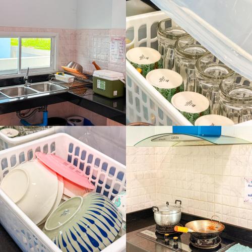 a kitchen with dishes in a drying rack next to a sink at BAN SINGH TO Poolvilla in Cha Am