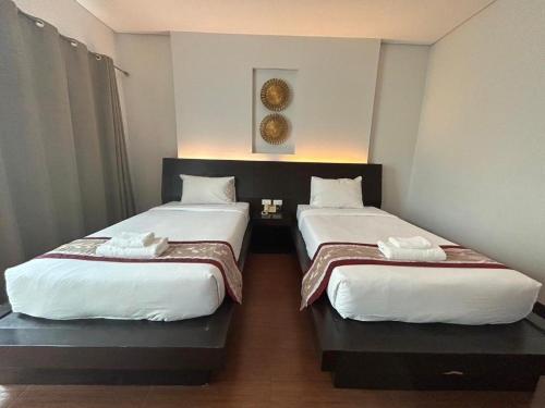 Ένα ή περισσότερα κρεβάτια σε δωμάτιο στο The O Valley Hotel