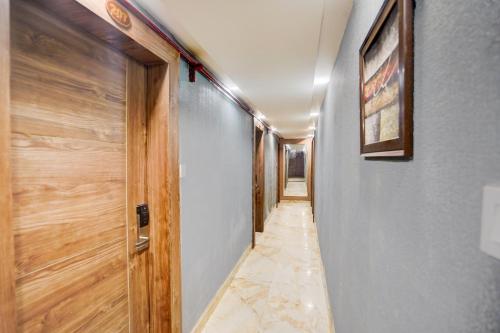 a hallway of a house with a door at Super Townhouse Prayagraj Central Bus Terminal Formerly Hotel Four View in Civil Lines