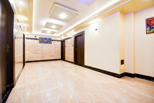 a room with a door and a tile floor at Super Townhouse Puri Formerly Hotel Narashingha in Puri