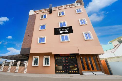 a building with a sign for a hotel at Super Townhouse Puri Formerly Hotel Narashingha in Puri