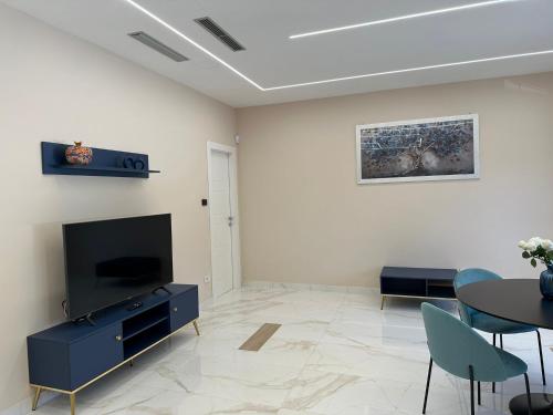 Μια τηλεόραση ή/και κέντρο ψυχαγωγίας στο D'MORO Quietea Apartment