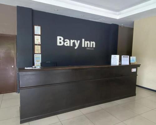 a banny inn sign on a wall in a lobby at Collection O KLIA Formerly Bary Inn in Sepang