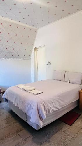 a bedroom with a large bed in a room at Happy Forest B&B in Katima Mulilo
