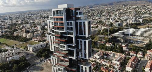 an aerial view of a tall building in a city at STAY ONLY Tower Suites in Limassol