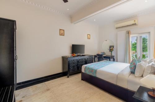 Postel nebo postele na pokoji v ubytování Surya Kothi Resort