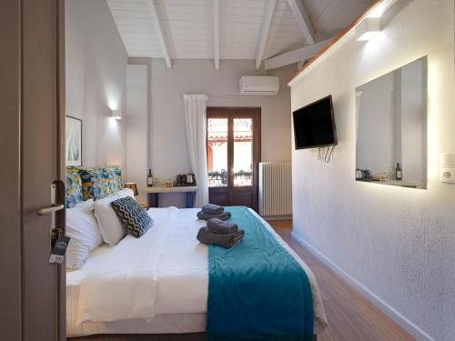 a bedroom with a bed with teddy bears on it at Spa Guest House by White Hills in the Heart of Arachova in Arachova