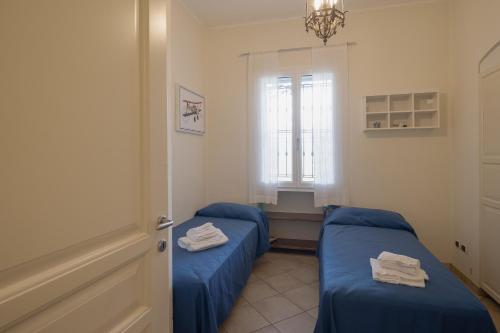 Postel nebo postele na pokoji v ubytování Residenza Gorleri charme e relax