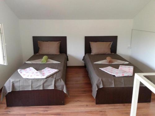 two beds in a small room with at BEATRIS in Ureki
