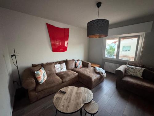 a living room with a couch and a table at Vivere Nient'Altro between port and historic center in Marano Lagunare