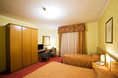 Ένα ή περισσότερα κρεβάτια σε δωμάτιο στο Hotel La Tonnara