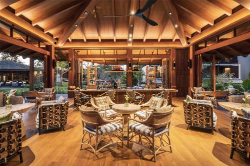 a dining room with a table and chairs at Andaz Pattaya Jomtien Beach, By Hyatt in Na Jomtien