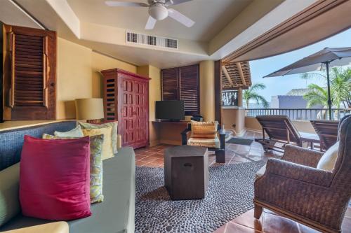 a living room with a couch and chairs at Hilton Grand Vacations Club Zihuatanejo in Zihuatanejo