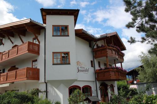 a building with balconies on the side of it at Hotel Sonnenhof - bed & breakfast & appartements in Innsbruck