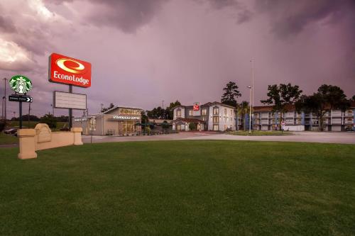 a building with a sign in the middle of a park at Econo Lodge Augusta North - Washington Road in Augusta