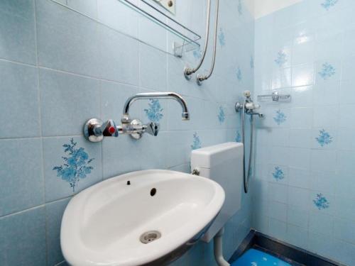 a bathroom with a white sink and a toilet at Holiday Home Jasminka - Three Bedroom Holiday Home with Terrace and Sea View in Potomje