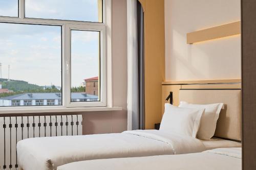 Φωτογραφία από το άλμπουμ του Suoxing Hotel Wulanbutong Scenic Area Branch σε Xiaogushan